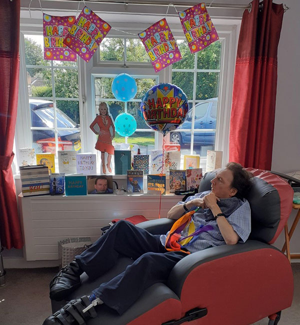 Darren at Balmaclellan, celebrating with lots of presents from his family who came to visit by social distancing through the window